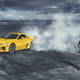 Illustration for article titled Boobs and expensive supercars! Lexus LFA drifts around Sports Illustrated swimsuit model